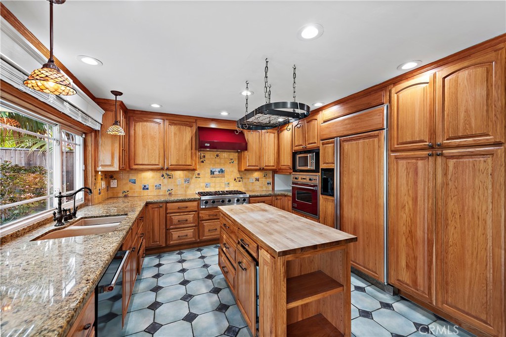 24372 Barbados Drive Dana Point, CA 92629 - Photo 11 of 39 a kitchen with stainless steel appliances granite countertop a sink a stove and a refrigerator