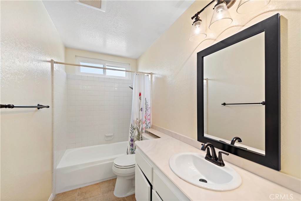 24372 Barbados Drive Dana Point, CA 92629 - Photo 24 of 39 a bathroom with a sink a toilet and a mirror