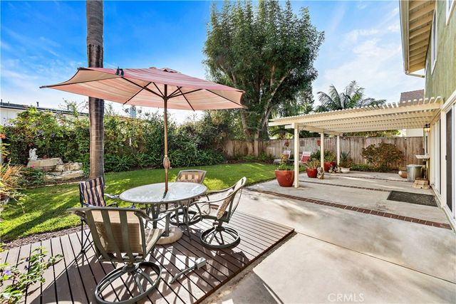 a view of a patio with a table chairs and a table
