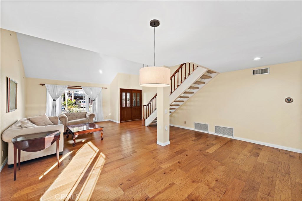 24372 Barbados Drive Dana Point, CA 92629 - Photo 4 of 39 a living room with furniture and a chandelier