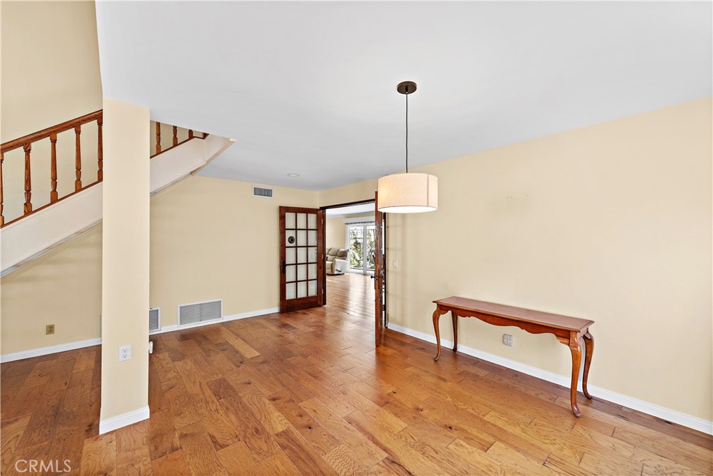 24372 Barbados Drive Dana Point, CA 92629 - Photo 5 of 39 a view of a room with wooden floor and stairs