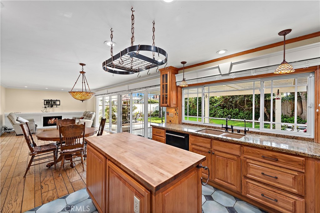 24372 Barbados Drive Dana Point, CA 92629 - Photo 6 of 39 a kitchen with stainless steel appliances granite countertop counter space a sink and living room view