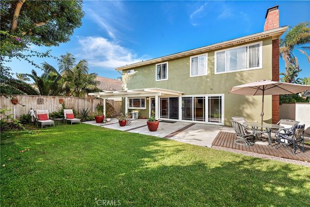 a front view of house with yard and outdoor seating