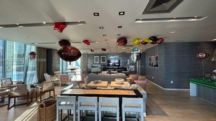 2900 Northeast 7th Avenue, Unit 1003 Miami, FL 33137 - Photo 11 of 15 a living room with furniture and a floor to ceiling window