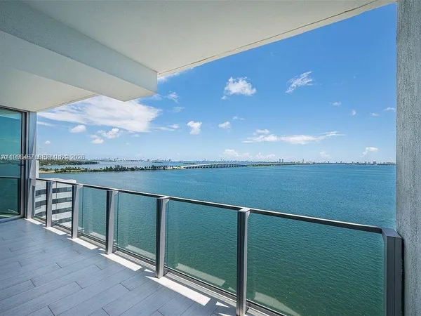 a view of a balcony with an ocean view