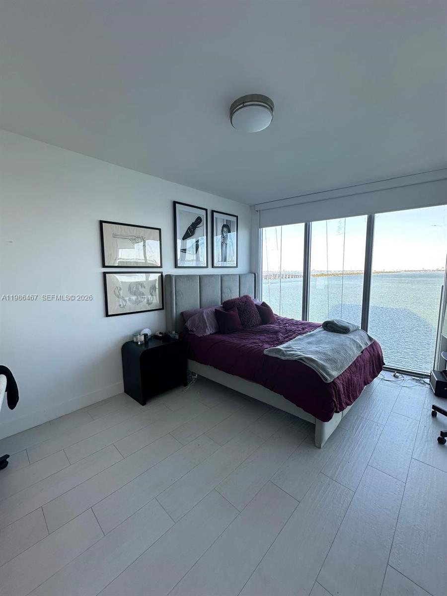 2900 Northeast 7th Avenue, Unit 1003 Miami, FL 33137 - Photo 9 of 15 a spacious bedroom with a bed and window