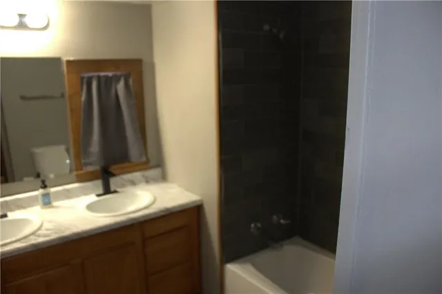 a bathroom with a toilet and sink