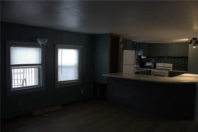 a kitchen with stainless steel appliances a sink stove and microwave