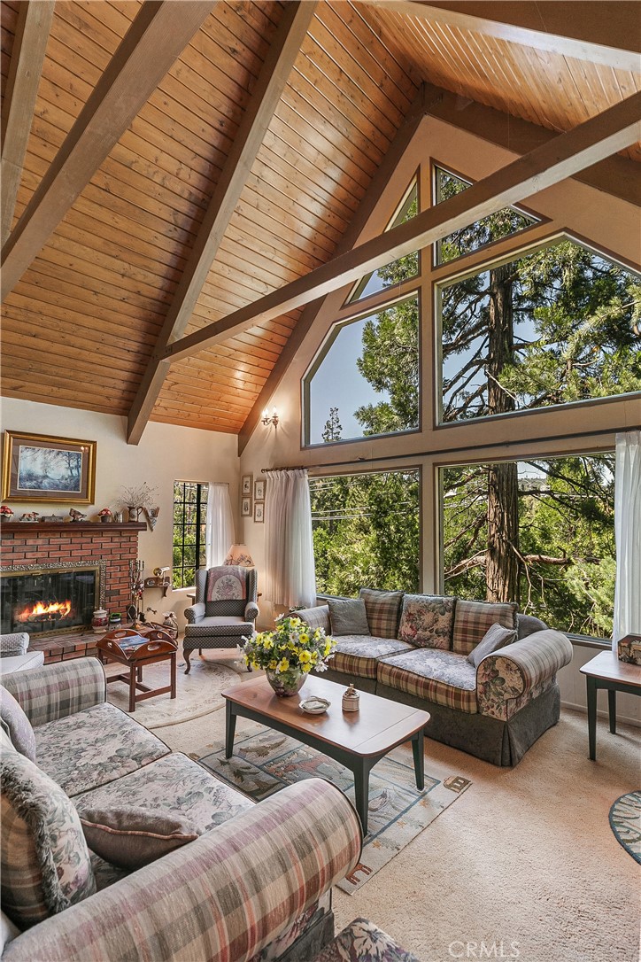 329 Grass Valley Road Lake Arrowhead, CA 92352 - Photo 2 of 31 a living room with furniture and a large window