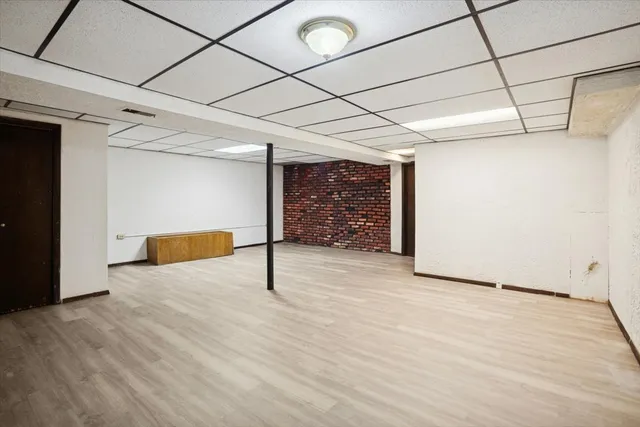 a view of a room with wooden floor