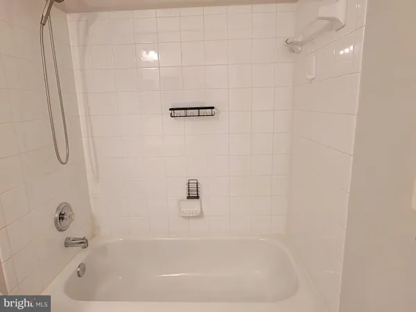 a close up of a bathtub curtain