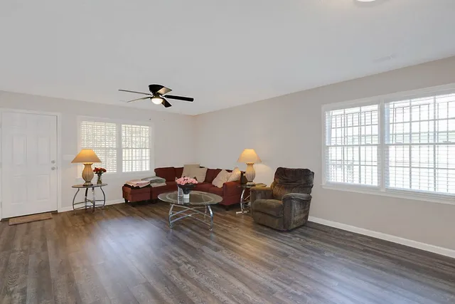 a living room with furniture and a window
