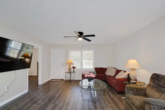 a living room with furniture and a flat screen tv