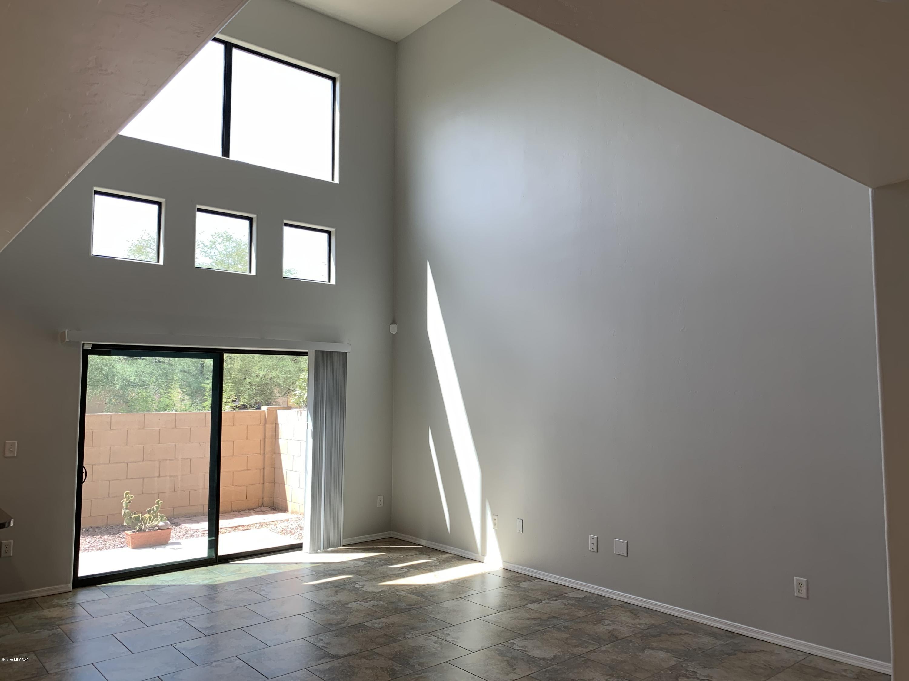 4181 North Fortune Loop Tucson, AZ 85719 - Photo 3 of 39 an empty room with large windows