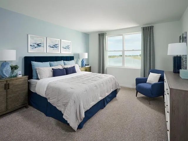 a bedroom with bed and window