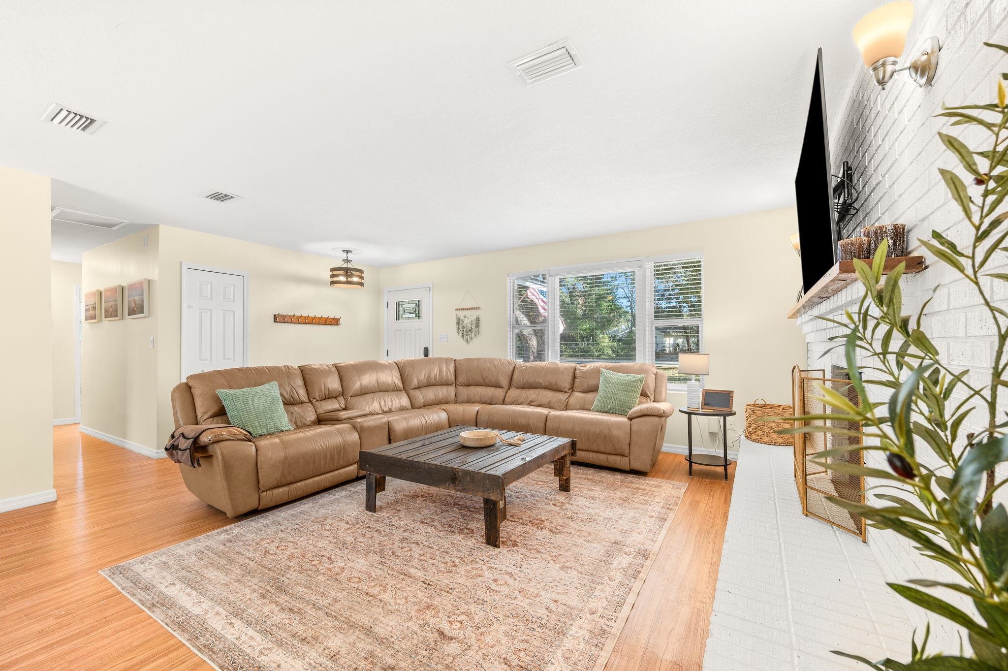 4233 Oak Lane St. Augustine, FL 32086 - Photo 13 of 42 Living room featuring light wood finished floors and baseboards