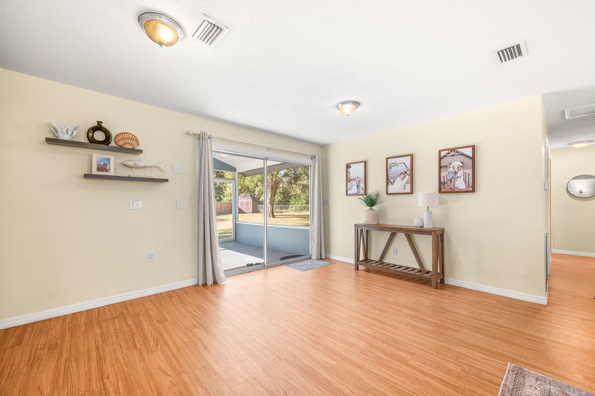 4233 Oak Lane St. Augustine, FL 32086 - Photo 14 of 42 Empty room featuring light wood finished floors