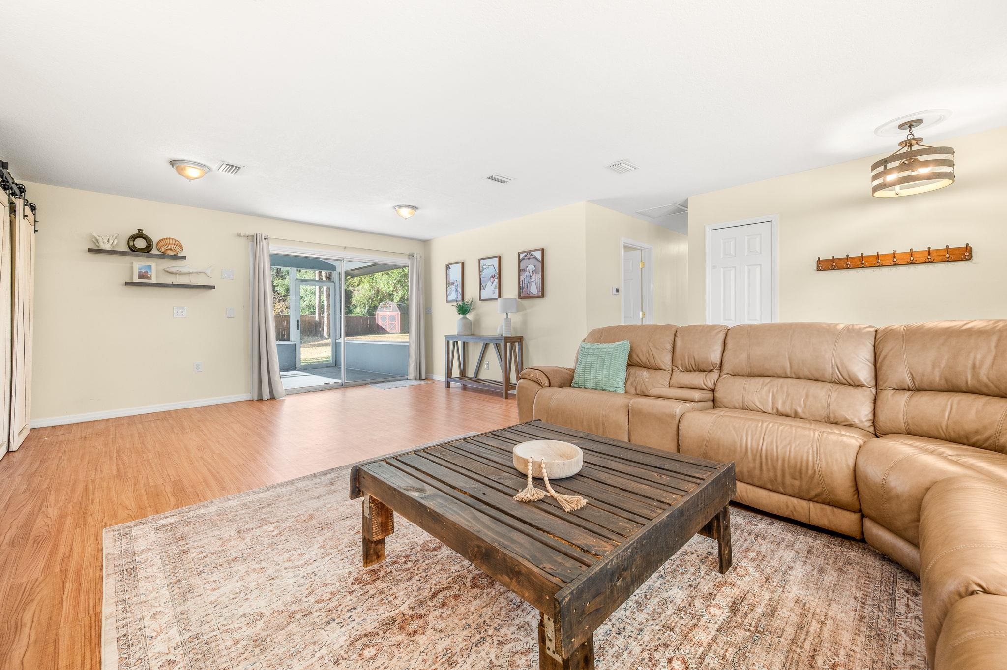 4233 Oak Lane St. Augustine, FL 32086 - Photo 16 of 42 Living room with light wood-type flooring and baseboards