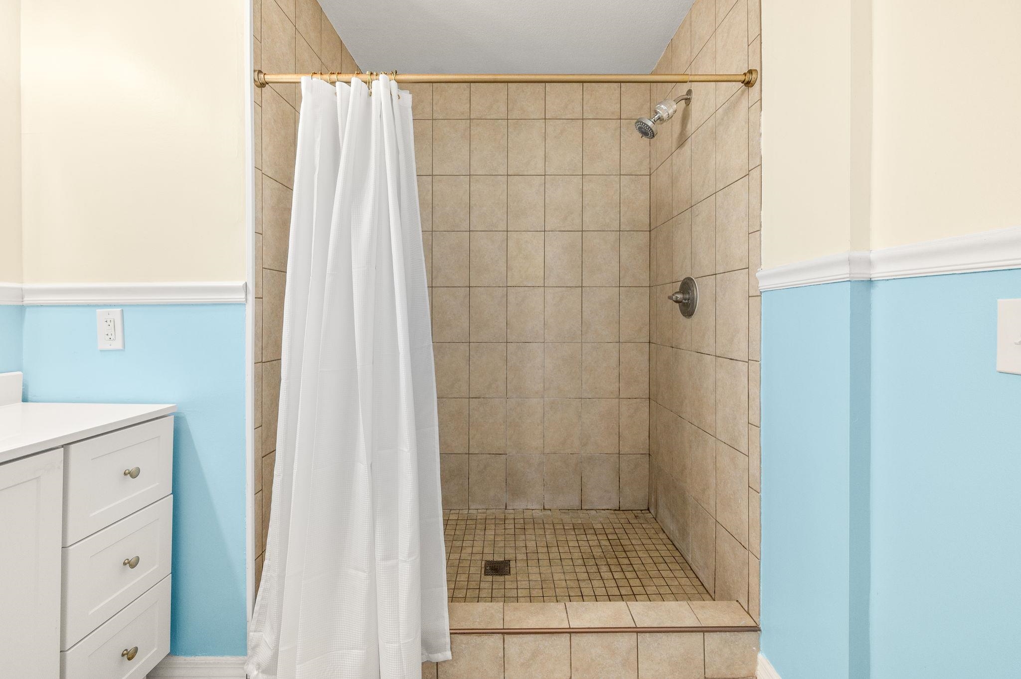 4233 Oak Lane St. Augustine, FL 32086 - Photo 34 of 42 Bathroom featuring vanity and a stall shower