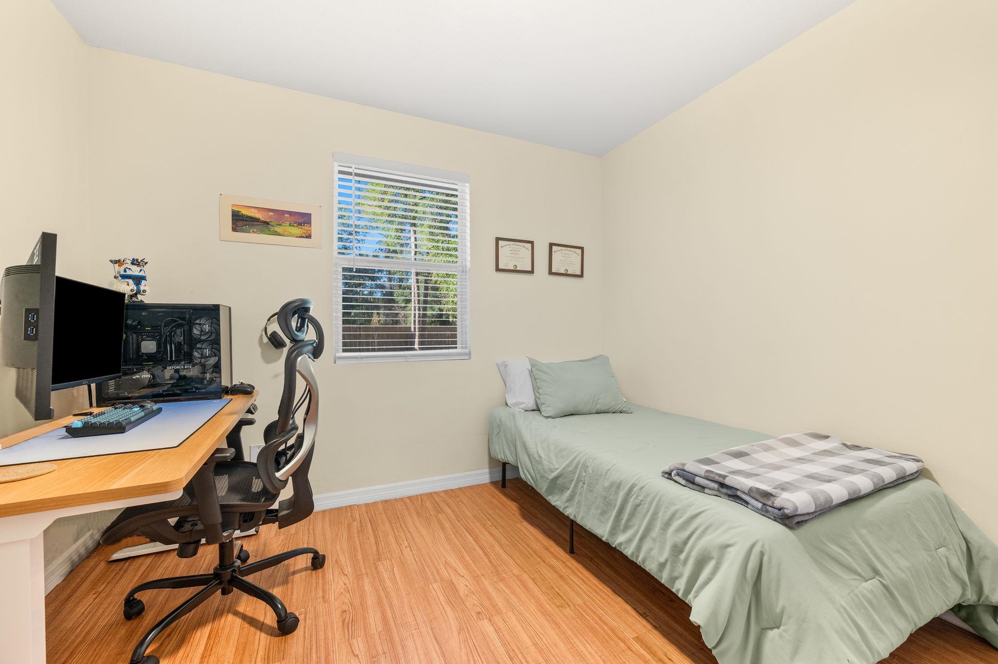 4233 Oak Lane St. Augustine, FL 32086 - Photo 35 of 42 Bedroom featuring a desk and light wood finished floors