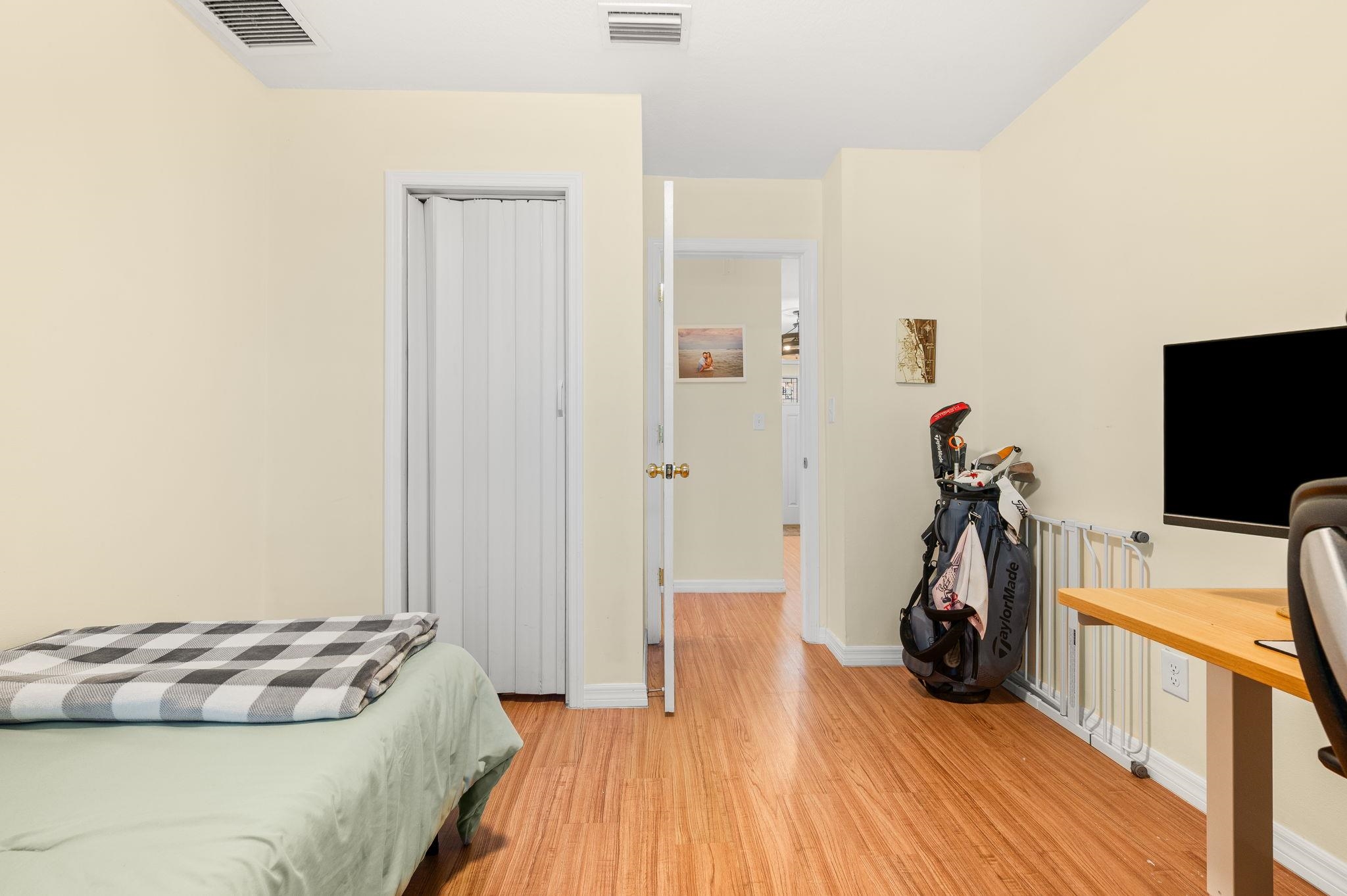 4233 Oak Lane St. Augustine, FL 32086 - Photo 36 of 42 Bedroom with light wood-style flooring and radiator
