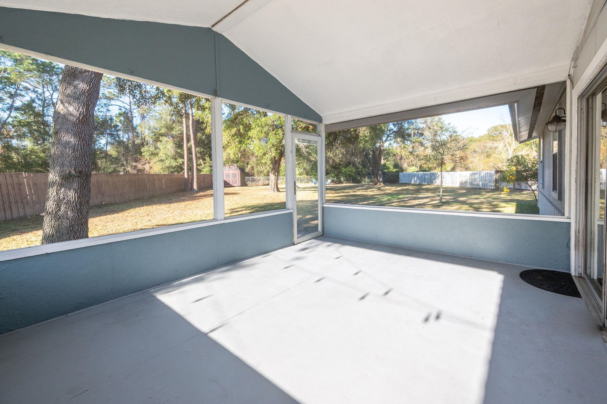 4233 Oak Lane St. Augustine, FL 32086 - Photo 37 of 42 Unfurnished sunroom with vaulted ceiling