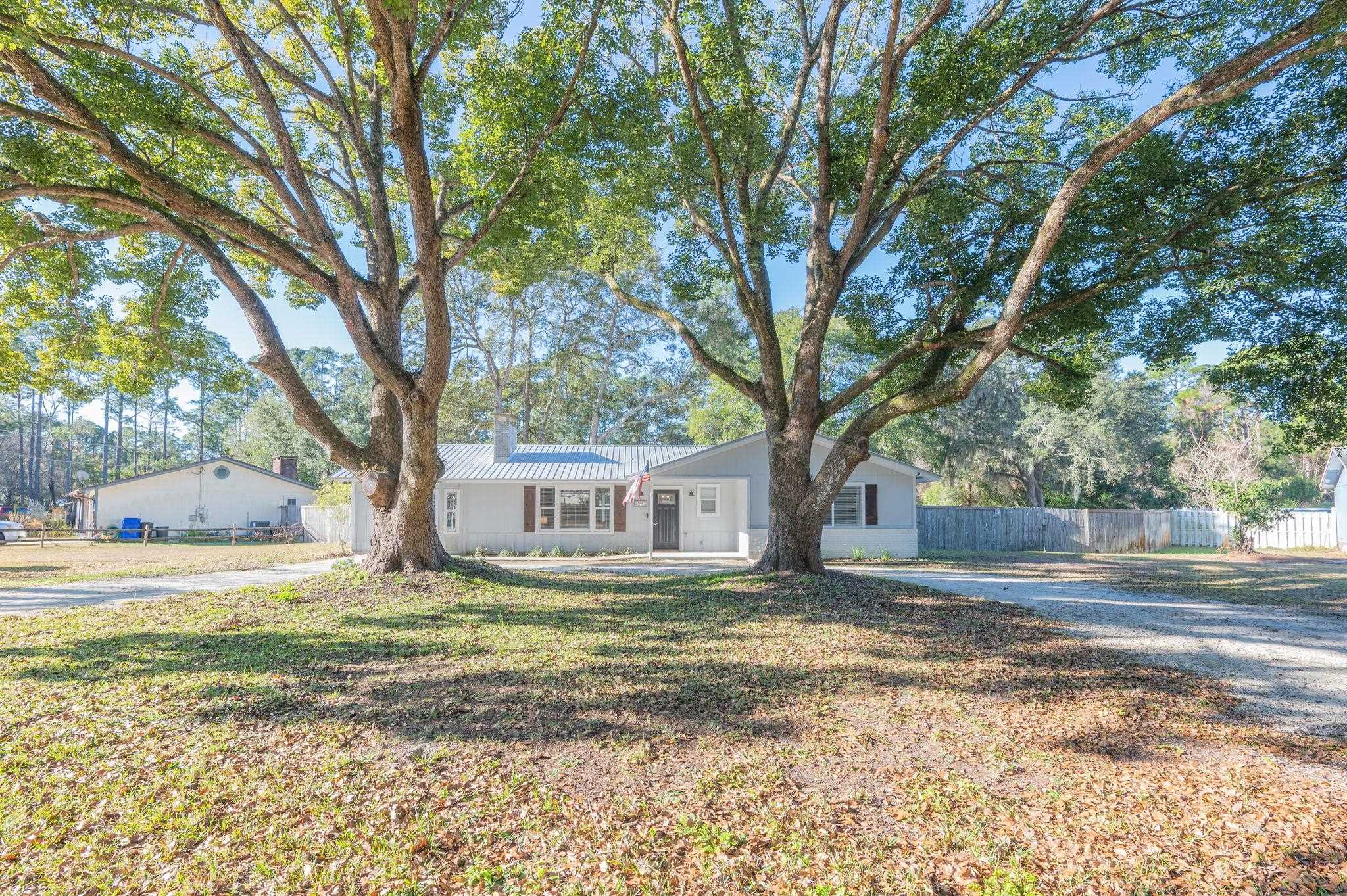 4233 Oak Lane St. Augustine, FL 32086 - Photo 6 of 42 Single story home with a metal roof and a chimney