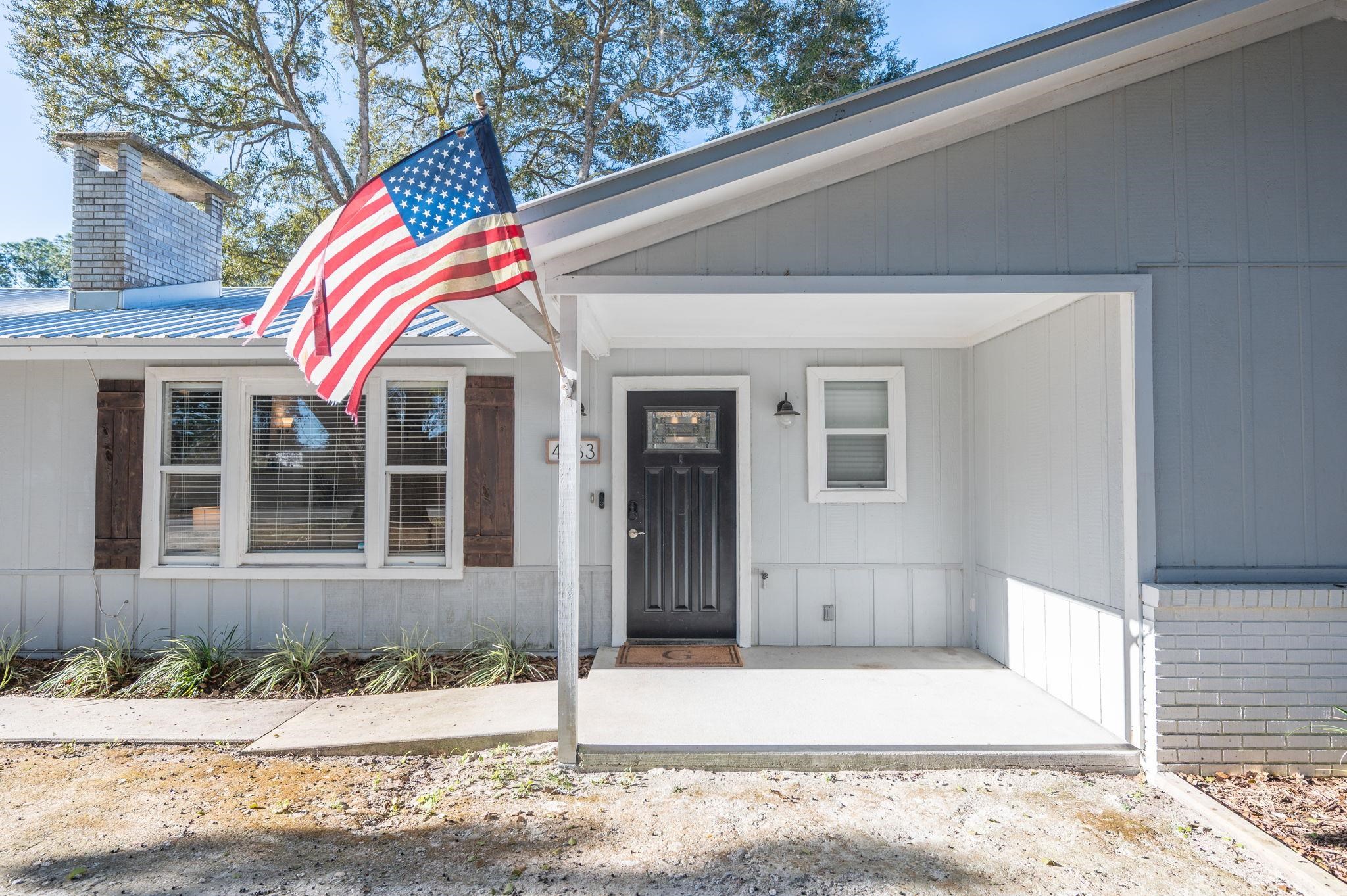 4233 Oak Lane St. Augustine, FL 32086 - Photo 7 of 42 Entrance to property featuring a metal roof