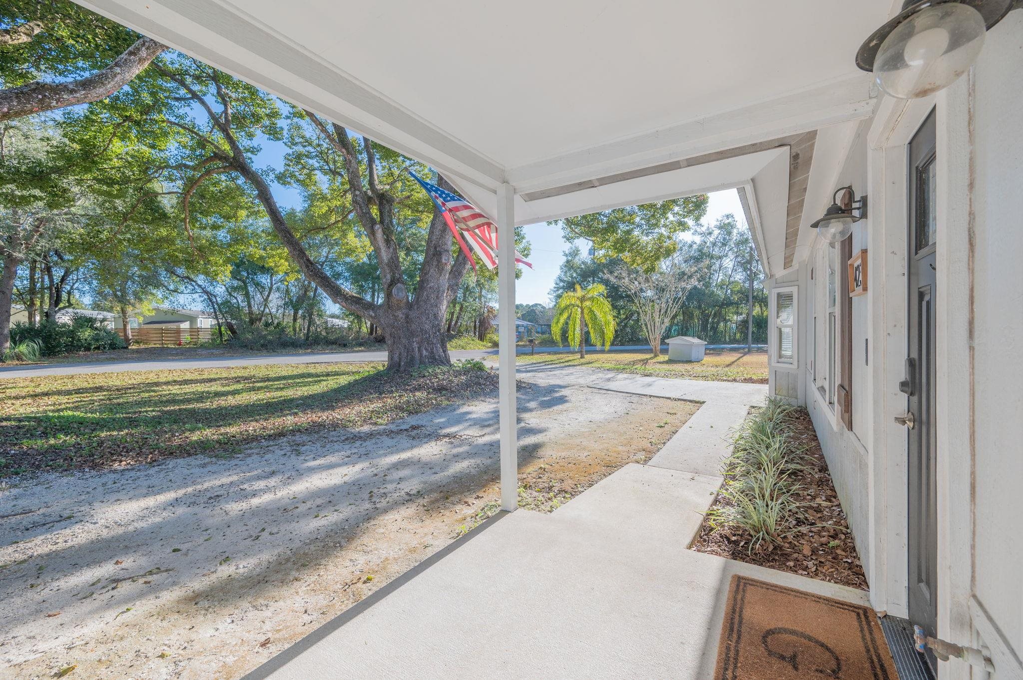 4233 Oak Lane St. Augustine, FL 32086 - Photo 9 of 42 View of yard featuring a porch