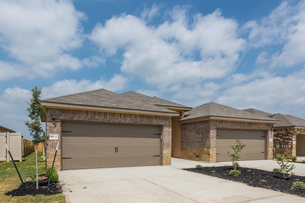 491 Jack Rabbit Lane, Unit A Buda, TX 78610 - Photo 1 of 22 A classic brick exterior with a welcoming two-car garage awaits.