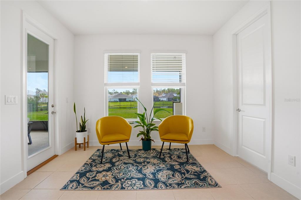 34068 Castaway Loop Wesley Chapel, FL 33543 - Photo 13 of 65 a living room with a rug and a window
