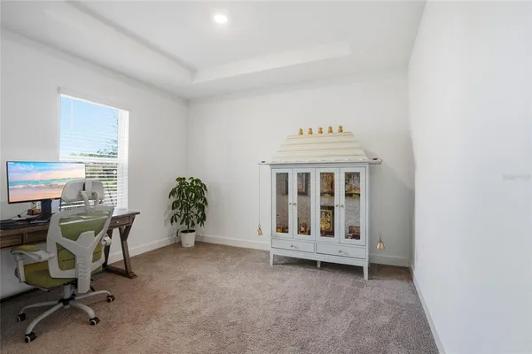 a spacious bedroom with a bed and a window