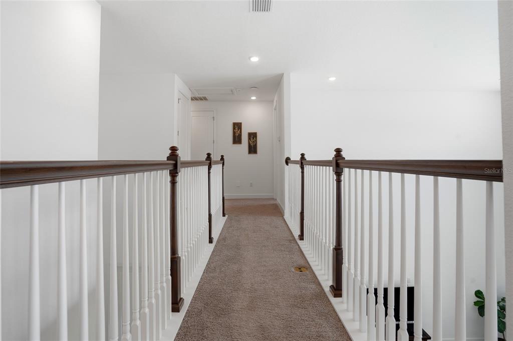 34068 Castaway Loop Wesley Chapel, FL 33543 - Photo 34 of 65 a view of a hallway with a couch