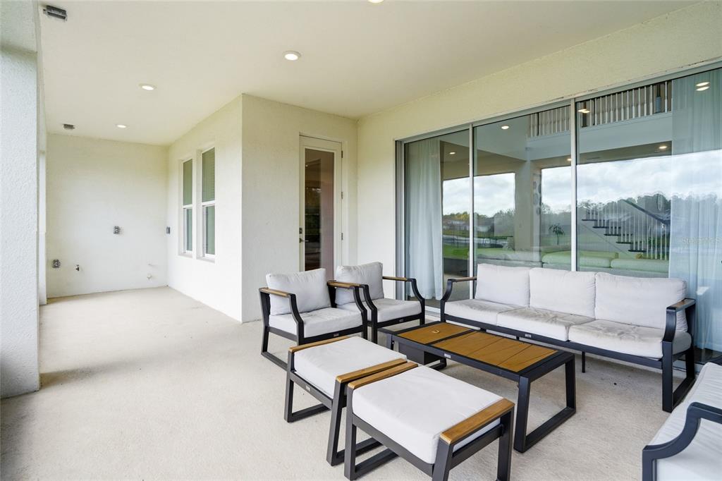 34068 Castaway Loop Wesley Chapel, FL 33543 - Photo 46 of 65 a living room with furniture and a window