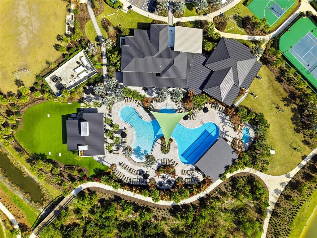 34068 Castaway Loop Wesley Chapel, FL 33543 - Photo 58 of 65 an aerial view of a house with a swimming pool