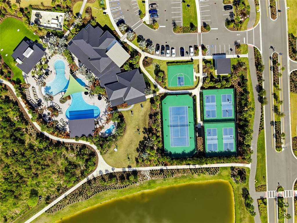 34068 Castaway Loop Wesley Chapel, FL 33543 - Photo 59 of 65 an aerial view of residential houses with outdoor space