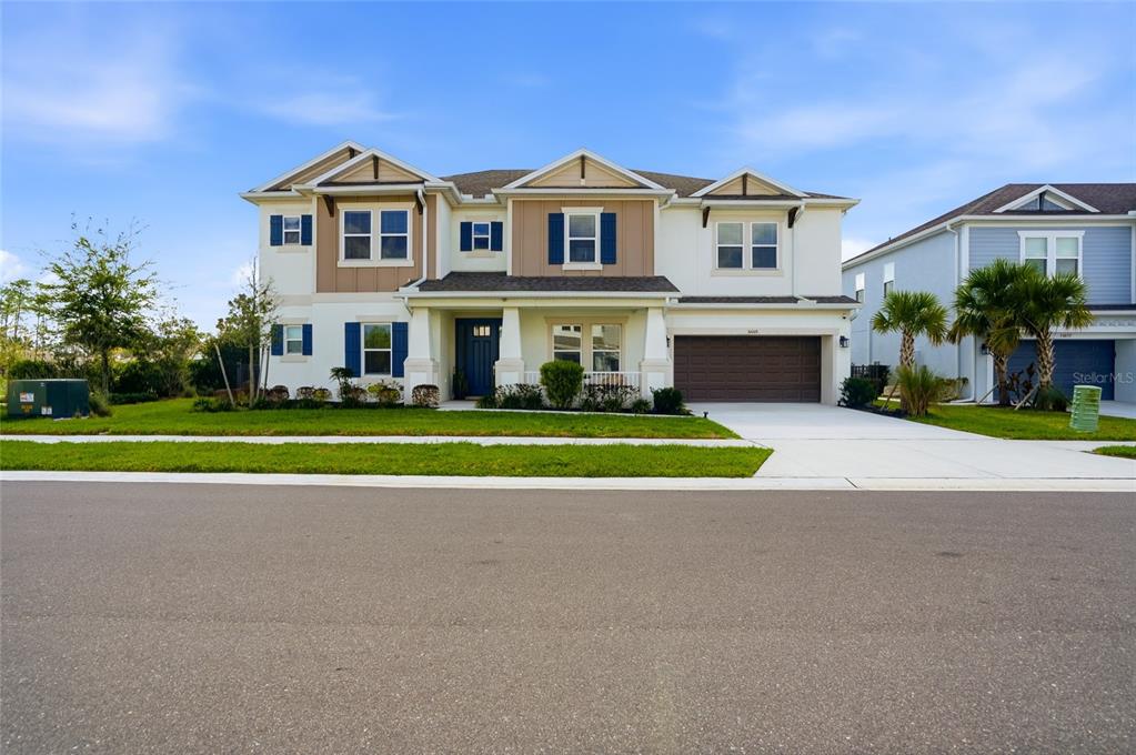 34068 Castaway Loop Wesley Chapel, FL 33543 - Photo 62 of 65 a view of house with a yard and potted plants