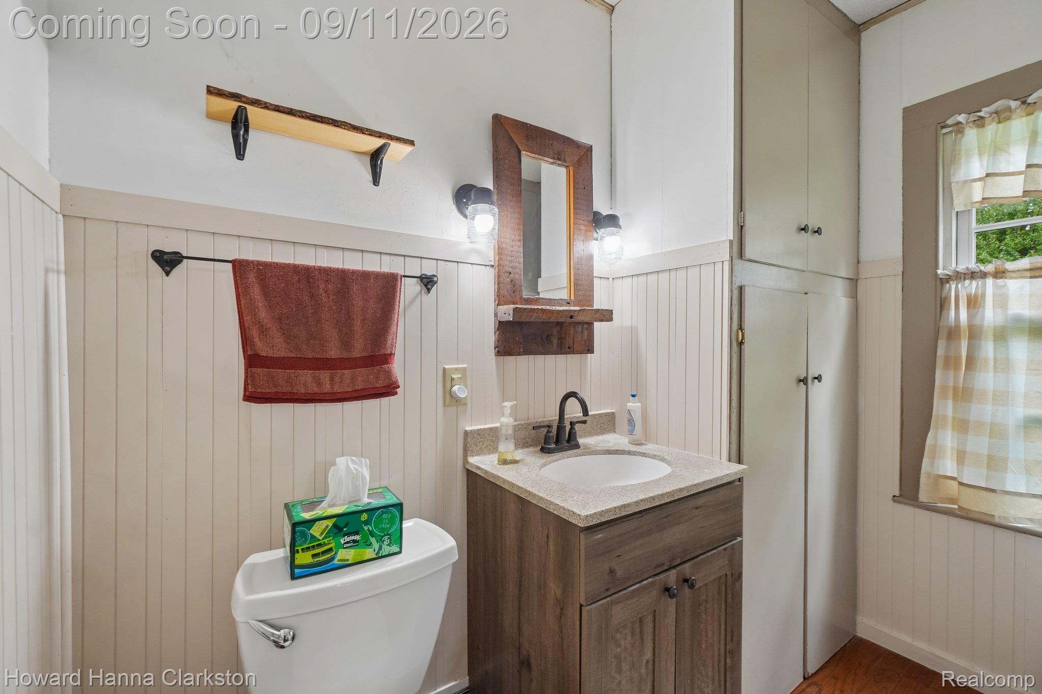 8301 Foster Road Clarkston, MI 48346 - Photo 14 of 41 Convenient 1st floor powder roomwith wood flooring.
