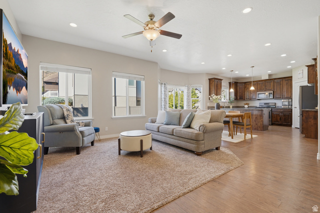 1997 East 600 South Springville, UT 84663 - Photo 16 of 54 Open-concept living space featuring wood-finish flooring, recessed lighting, and a ceiling fan
