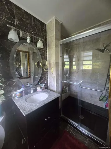 a bathroom with a sink a vanity and a mirror