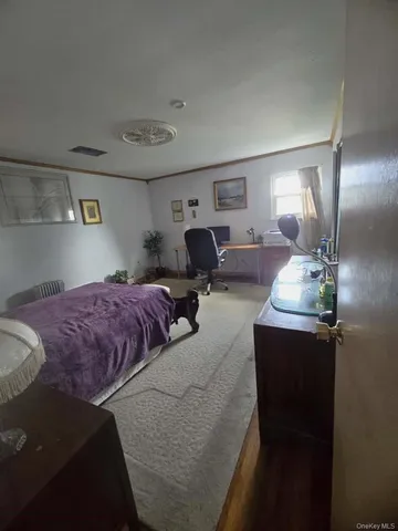 a bedroom with bed and window