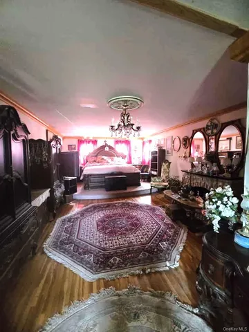 a room with lots of flowers and painting on the wall