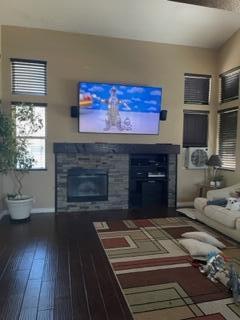 42107 Quail Run Way Lancaster, CA 93536 - Photo 14 of 38 a living room with furniture a flat screen tv and a fireplace