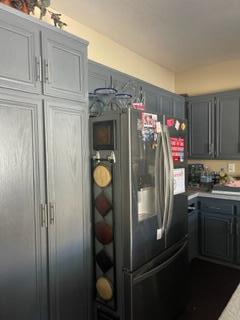 42107 Quail Run Way Lancaster, CA 93536 - Photo 16 of 38 a kitchen with metallic refrigerator and cabinets