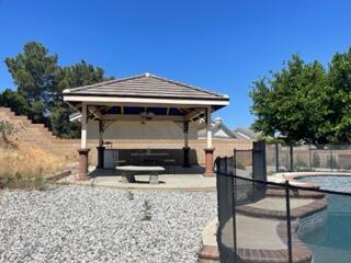 42107 Quail Run Way Lancaster, CA 93536 - Photo 22 of 38 a front view of a house with garden