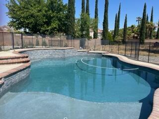 42107 Quail Run Way Lancaster, CA 93536 - Photo 23 of 38 a view of outdoor space and swimming pool