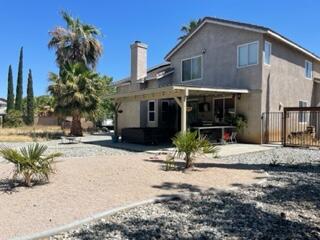 42107 Quail Run Way Lancaster, CA 93536 - Photo 26 of 38 a front view of a house with a yard