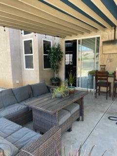 42107 Quail Run Way Lancaster, CA 93536 - Photo 28 of 38 a view of living room filled with furniture and a potted plant