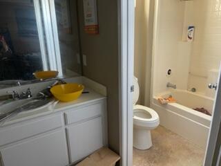 42107 Quail Run Way Lancaster, CA 93536 - Photo 35 of 38 a bathroom with a granite countertop sink toilet and shower