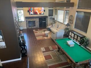 42107 Quail Run Way Lancaster, CA 93536 - Photo 7 of 38 a living room with furniture a fireplace and a flat screen tv